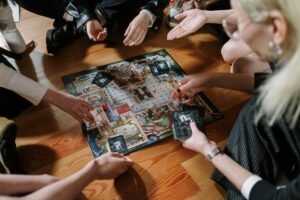group of people playing a strategy board game